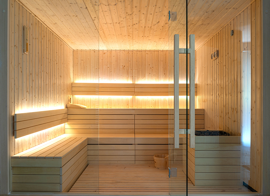 Front view of empty Finnish sauna room. Modern interior of wooden spa cabin with dry steam